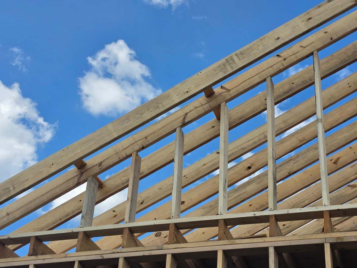 Living the Dream Year 6 Day 154 – Clifty Hill 3 – Framing Day 50, Garage walls are sheathed and covered with Tyvek